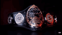 a nwa world heavyweight championship belt is laying on a bed