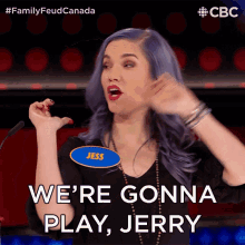 a woman with purple hair has a name tag that says jess