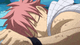 a man with red hair is laying down with his eyes closed and a white shirt on