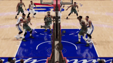 a group of basketball players are playing on a court with the word bucks on the wall