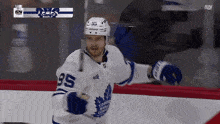 a toronto maple leafs hockey player with the number 35 on his jersey