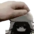 a close up of a person 's hand holding a toaster over a person 's head .