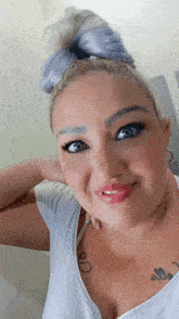 a woman with a tattoo on her chest that says " i love you "