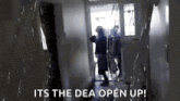 a person standing in a hallway with the words " its the dea open up " on the bottom
