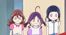 three cartoon girls are standing next to each other and one has a letter s on her head