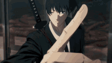 a man in a suit holds a sword in his left hand