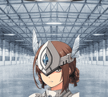 a girl wearing a helmet with wings is standing in an empty warehouse