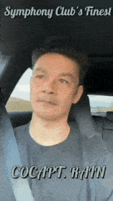 a man is sitting in the back seat of a car with the caption cocapt rain