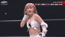 a woman in a wrestling ring with the words #stardom on the bottom