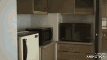 a kitchen with a microwave and a refrigerator and the words made in animotica on the bottom