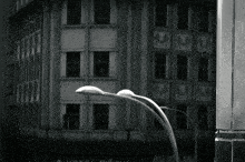a black and white photo of a building that says hotel