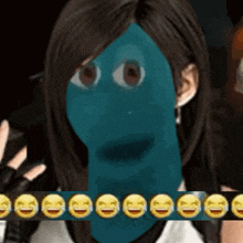 a woman with a blue face is surrounded by laughing emoticons