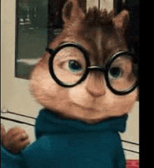 a close up of a chipmunk wearing glasses and a blue shirt .