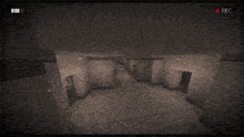 a black and white image of a hallway with a rec button