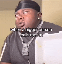 a man is holding a styrofoam container with the caption when a bigger person calls me fat