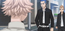 a group of anime characters standing next to each other on a street .