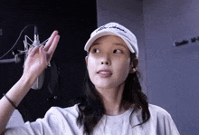 a woman wearing a white hat that says fly athens on it