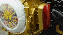 a close up of a toy with a clock and a red light