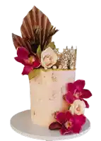 a cake with flowers and a crown that says axc on top