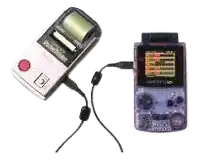 a purple game boy is plugged into a white game boy .