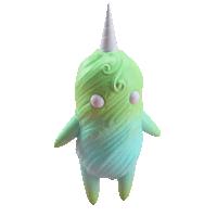 a green and blue figurine with a white horn on top