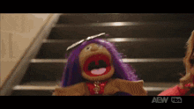 a puppet with purple hair is standing on a set of stairs ..