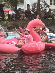 a man in a pink shirt is sitting on an inflatable flamingo in the water