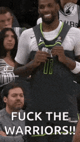 a basketball player is sitting in the stands during a game and says `` fuck the warriors !! ''