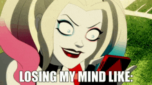 a cartoon harley quinn is holding a cell phone and says losing my mind like