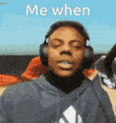 a man wearing headphones with the words me when on the bottom
