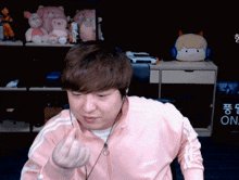 a man wearing a pink jacket that says nerdy
