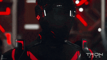 a man is wearing a helmet that says tron ares on it