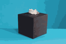 a person 's hand is sticking out of a box and giving a middle finger
