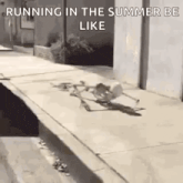 a skeleton is running down a sidewalk in the summer like a person .