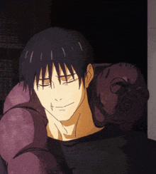 a man in a black shirt is smiling with his eyes closed and a purple object behind him