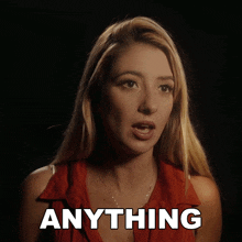 a woman in a red shirt says anything in a black background