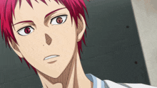 a close up of a person 's face with red hair and red eyes