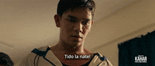 a man says tido la nate in front of a kahar sign