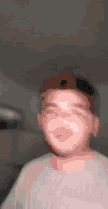 a man with a beard is taking a selfie with his eyes closed .