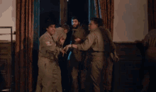 a group of soldiers are standing in a room
