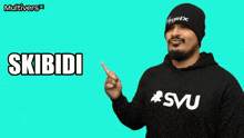 a man wearing a beanie and a sweatshirt with the word skibidi on it