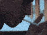 a man is lighting a cigarette with a match