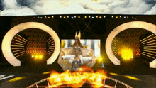 a woman in a white and gold costume stands in front of a stage