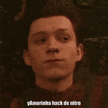 a close up of a man 's face with the words yamorinha hack de nitro below him