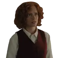 a woman with red curly hair wearing a white shirt and a red vest