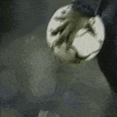 a soccer ball is being kicked by a person