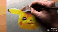 a person is drawing a pikachu wearing a hat with a pencil