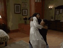 a man and a woman are dancing in a room