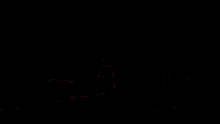 a dark background with a few spots of light