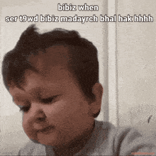 a baby making a funny face with the words bibiz when